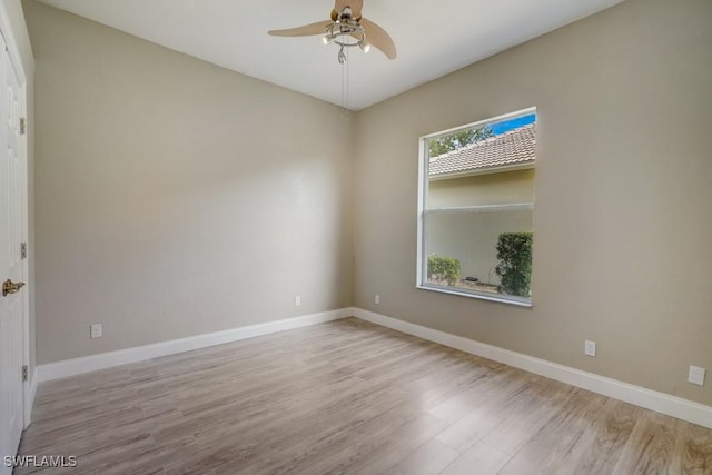 empty room featuring ceiling fan and light hardwood / wood-style floors