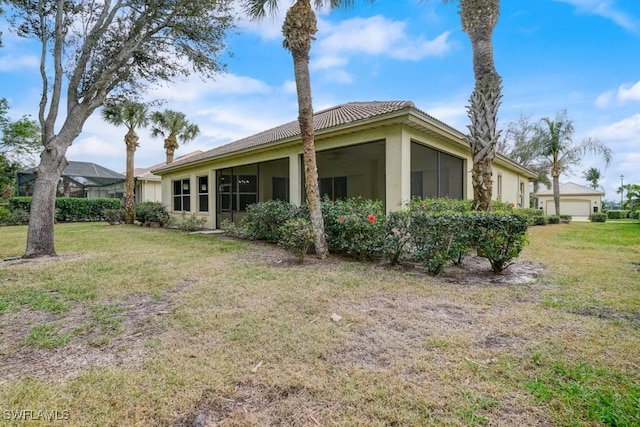 back of house with a yard