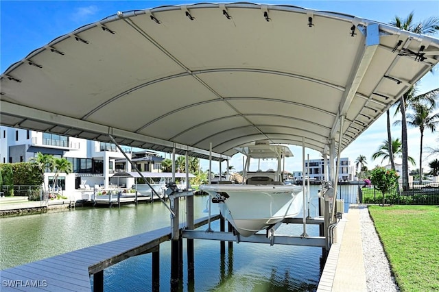 view of dock with a water view and boat lift