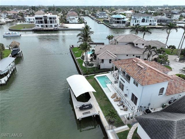 aerial view featuring a water view and a residential view