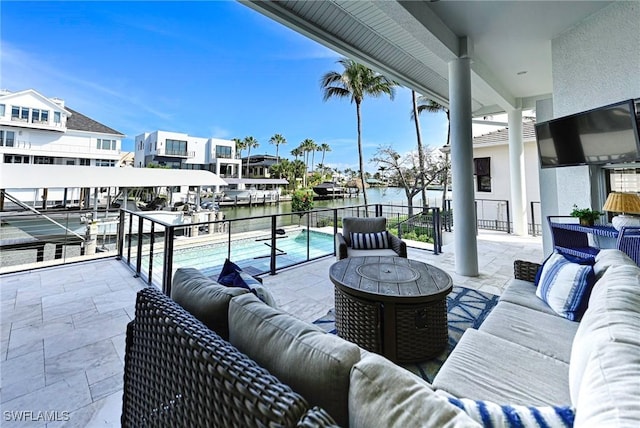 view of patio featuring outdoor lounge area and a community pool