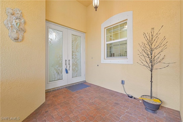 property entrance featuring french doors