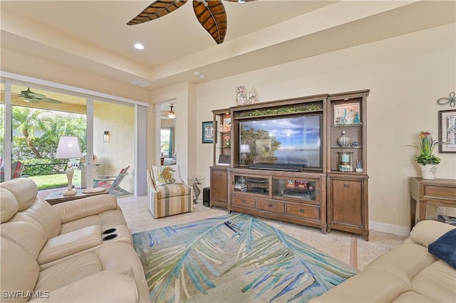 living room featuring light tile patterned floors, baseboards, a ceiling fan, and recessed lighting