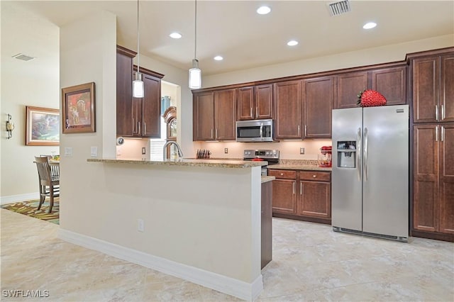 kitchen with visible vents, appliances with stainless steel finishes, light stone counters, pendant lighting, and recessed lighting