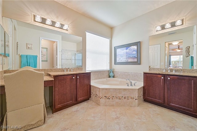 bathroom with two vanities, a sink, a bath, and a shower stall