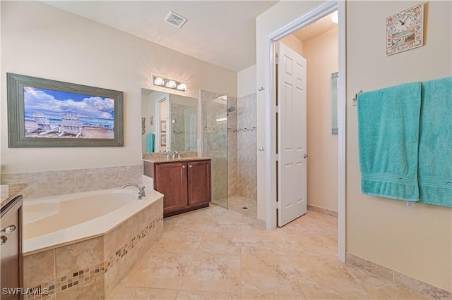 full bathroom with a stall shower, visible vents, a bath, and vanity