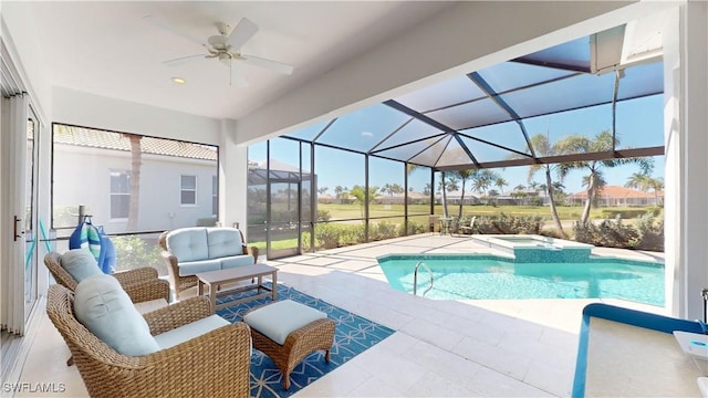 view of pool with a pool with connected hot tub, an outdoor hangout area, a ceiling fan, glass enclosure, and a patio area