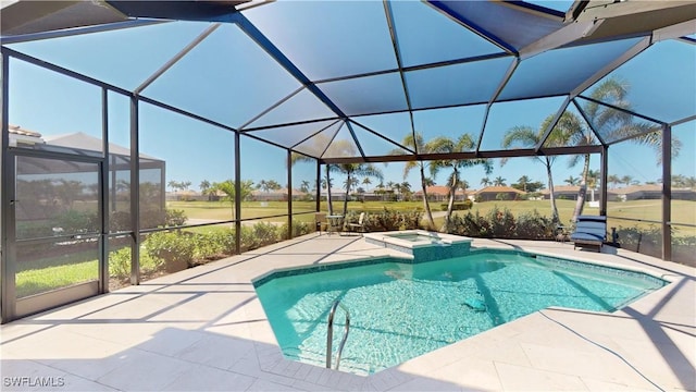 view of swimming pool with a pool with connected hot tub, glass enclosure, and a patio