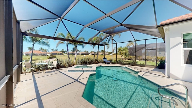 view of swimming pool with a pool with connected hot tub, glass enclosure, and a patio