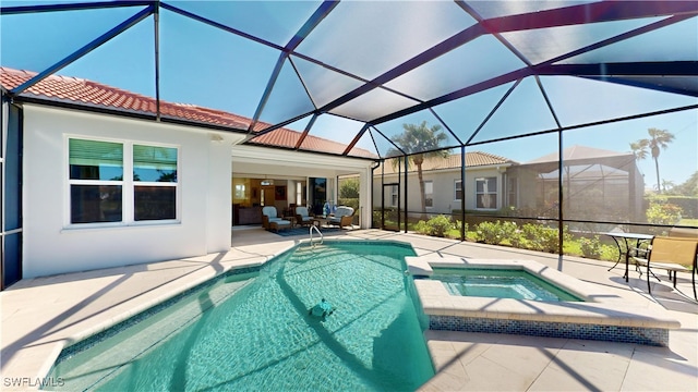 view of pool featuring a lanai, a patio area, and a pool with connected hot tub