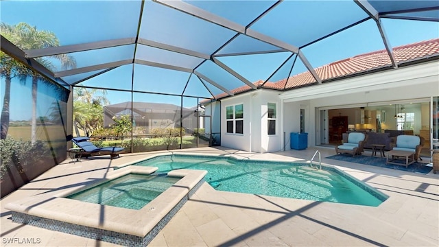 view of pool featuring a patio, a lanai, and a pool with connected hot tub