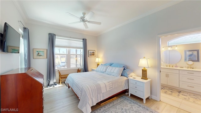 bedroom with ensuite bathroom, ornamental molding, light wood-type flooring, and a ceiling fan