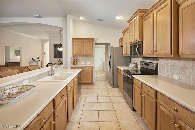 kitchen with light countertops, stainless steel appliances, visible vents, open floor plan, and a sink