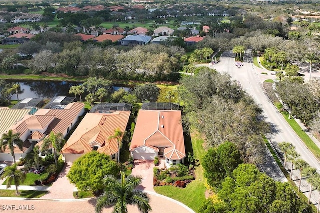 bird's eye view with a water view and a residential view