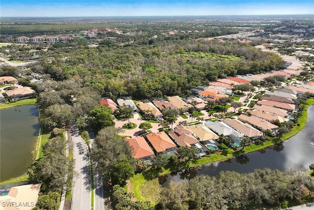 bird's eye view featuring a water view and a residential view