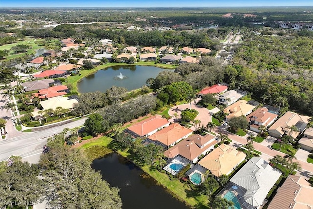 birds eye view of property featuring a water view and a residential view