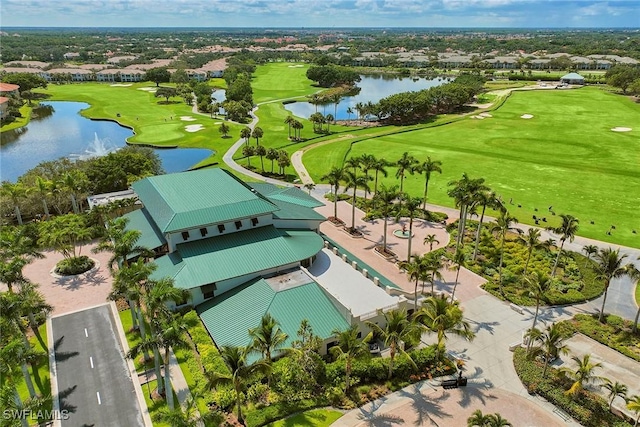 aerial view featuring golf course view and a water view