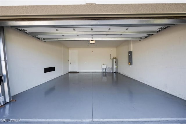 garage featuring electric panel, a garage door opener, and electric water heater