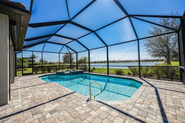 view of swimming pool with a pool with connected hot tub, a water view, a patio, and a lanai