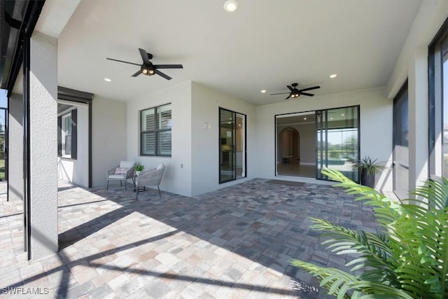 view of patio featuring ceiling fan