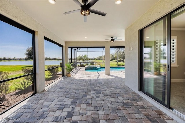 unfurnished sunroom with a water view