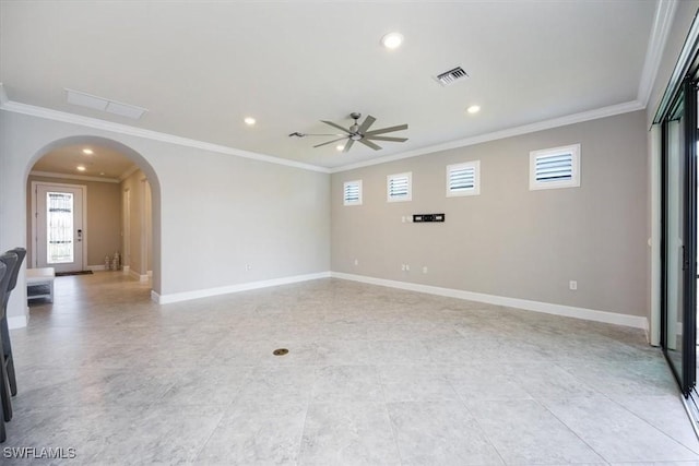 empty room featuring arched walkways, recessed lighting, visible vents, ornamental molding, and baseboards