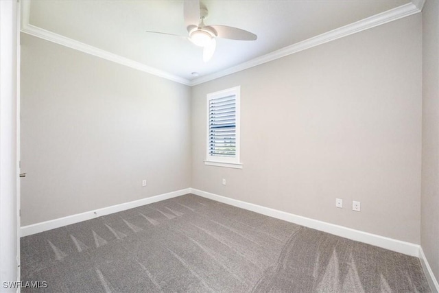 unfurnished room featuring baseboards, ornamental molding, dark colored carpet, and a ceiling fan