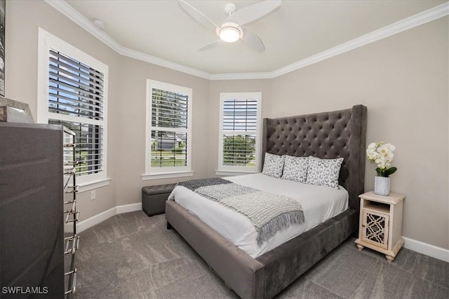 bedroom with ornamental molding, carpet, multiple windows, and baseboards