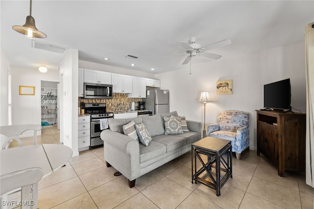 living room featuring recessed lighting, visible vents, ceiling fan, and light tile patterned floors