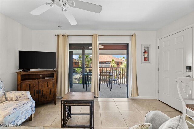 1811 Olde Middle Gulf Dr Unit 10, Sanibel, FL 33957 - living area with light tile patterned floors and ceiling fan