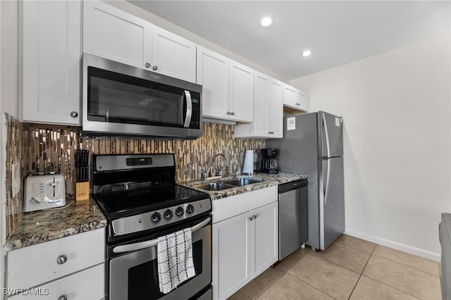 1811 Olde Middle Gulf Dr Unit 10, Sanibel, FL 33957 - kitchen featuring tasteful backsplash, appliances with stainless steel finishes, dark stone counters, and a sink