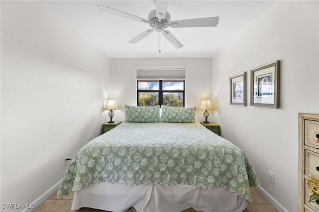 1811 Olde Middle Gulf Dr Unit 10, Sanibel, FL 33957 - bedroom with tile patterned floors, a ceiling fan, and baseboards