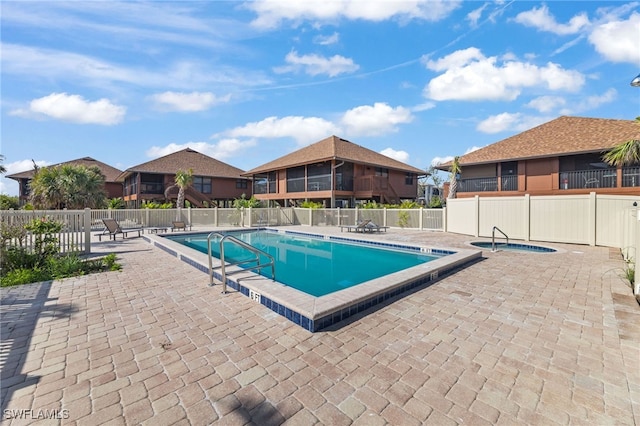 1811 Olde Middle Gulf Dr Unit 10, Sanibel, FL 33957 - pool with fence, a community hot tub, and a patio