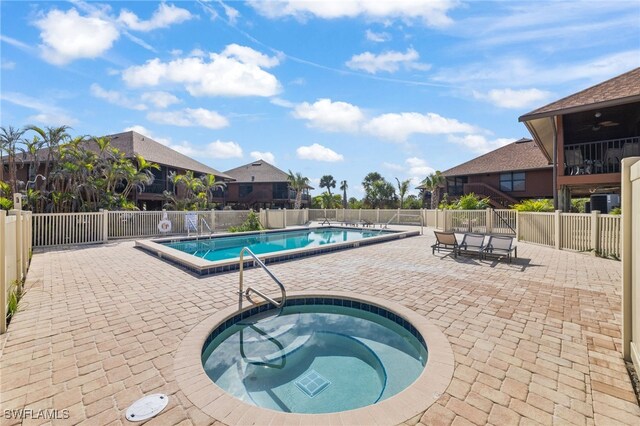 1811 Olde Middle Gulf Dr Unit 10, Sanibel, FL 33957 - community pool featuring a patio, fence, and a hot tub