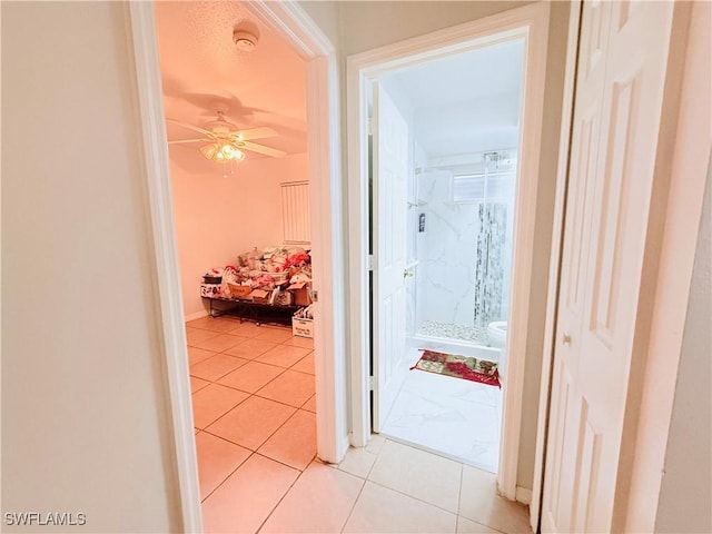 corridor with light tile patterned floors