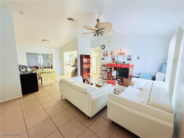 living area featuring lofted ceiling, ceiling fan, light tile patterned flooring, and visible vents