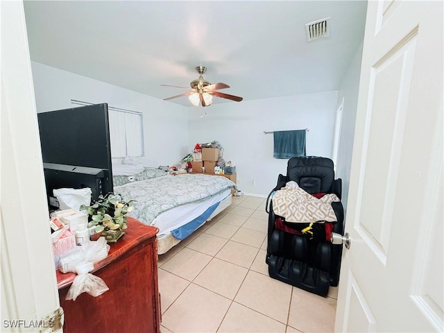 bedroom with light tile patterned floors, visible vents, and a ceiling fan