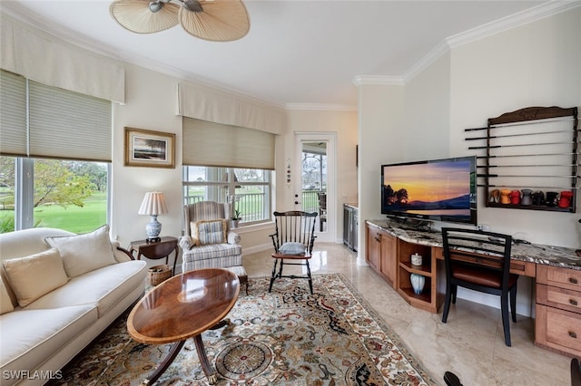 living area featuring built in desk, baseboards, and crown molding