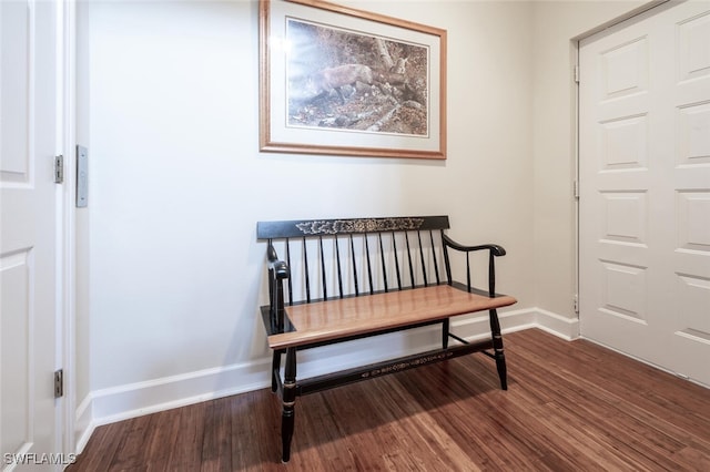 sitting room featuring baseboards and wood finished floors