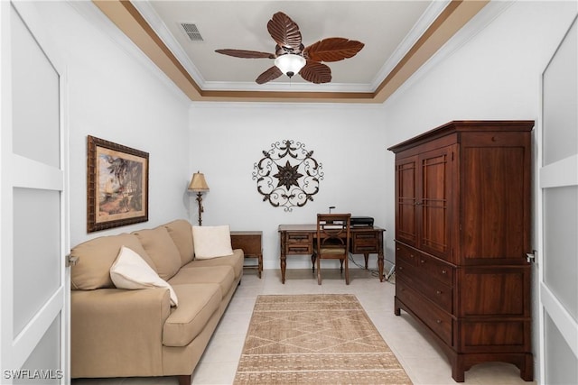 office with crown molding, light tile patterned floors, a ceiling fan, and visible vents