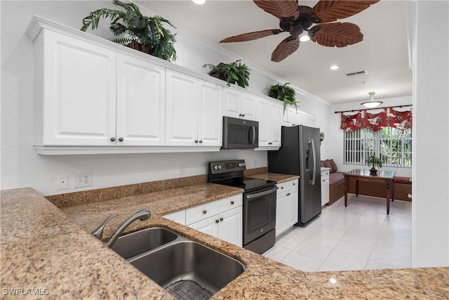 kitchen with visible vents, ornamental molding, appliances with stainless steel finishes, white cabinetry, and a sink