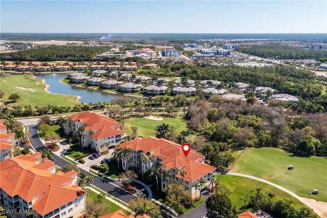 aerial view with a water view and golf course view