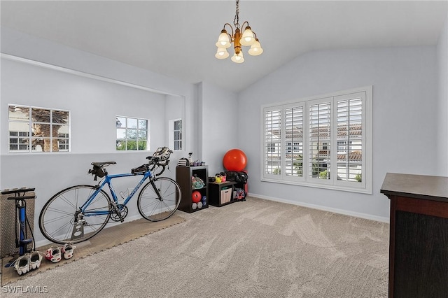 exercise area with a chandelier, carpet, vaulted ceiling, and baseboards