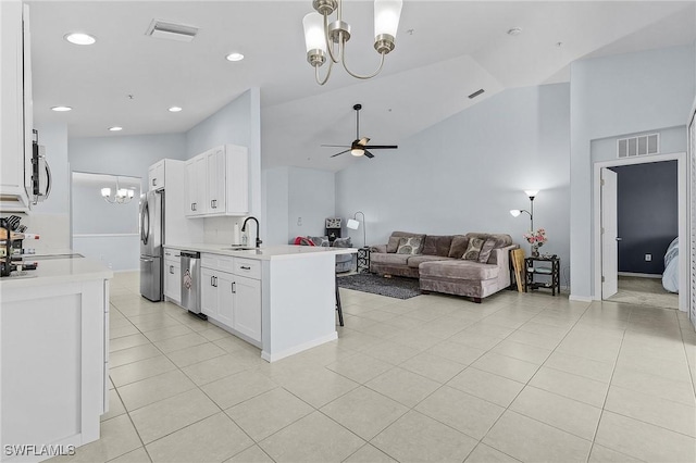 kitchen with visible vents, stainless steel appliances, a sink, and light countertops