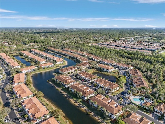 birds eye view of property featuring a water view and a residential view