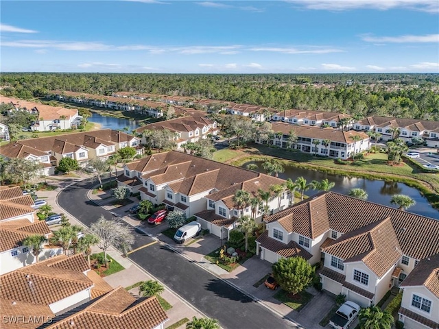 birds eye view of property featuring a residential view and a water view