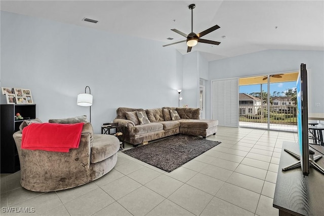 living area with lofted ceiling, tile patterned flooring, visible vents, and ceiling fan