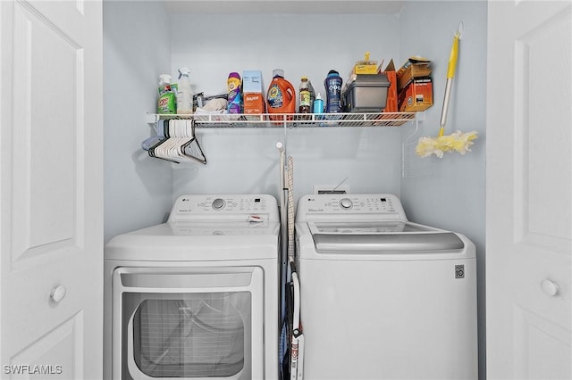 laundry area with laundry area and separate washer and dryer