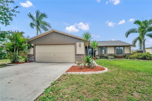 single story home featuring a garage, a front yard, concrete driveway, and stucco siding