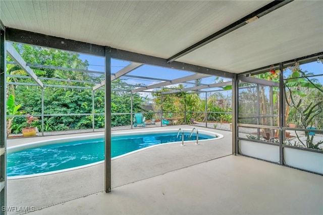 outdoor pool featuring a patio and a lanai